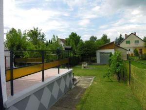 a balcony with a basketball hoop on top of a house at Holiday home Balatonlelle - Balaton 19071 in Balatonlelle