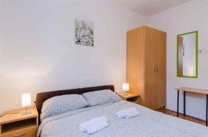 Posteľ alebo postele v izbe v ubytovaní Apartment in Crikvenica 5267