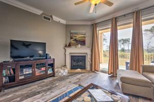 a living room with a television and a fireplace at 30A Retreat with Patio and Resort Amenities! in Santa Rosa Beach