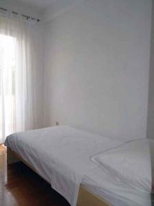 Postel nebo postele na pokoji v ubytování Apartment Okrug Gornji 32