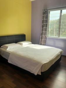 Säng eller sängar i ett rum på THE CLOUD KINABALU- HOUSE