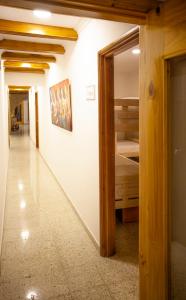 Postel nebo postele na pokoji v ubytování Hostal El Bando