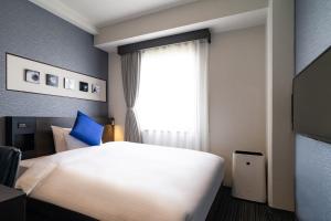 Postel nebo postele na pokoji v ubytování Goi Grand Hotel + 37 fotografií