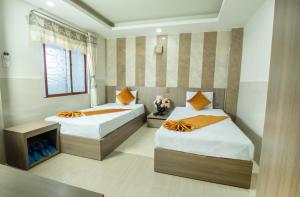 Postel nebo postele na pokoji v ubytování Oliver Hotel
