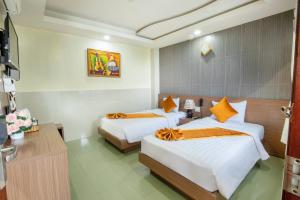 Postel nebo postele na pokoji v ubytování Oliver Hotel