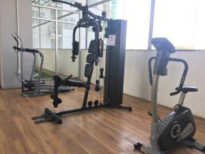 a gym with several exercise bikes on the floor at Comfy Studio Apartment at Harvard Jatinangor near UNPAD By Travelio in Sayang