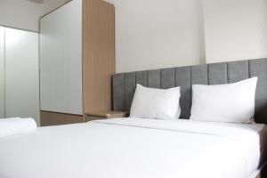 Katil atau katil-katil dalam bilik di Deluxe & Cozy 3BR at Gateway Pasteur Apartment By Travelio