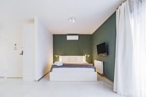 Televízia a/alebo spoločenská miestnosť v ubytovaní Odra View Apartments III
