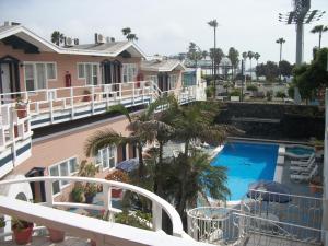 a view of a pool from the balcony of a resort at Hotel Villa Fontana Inn in Ensenada