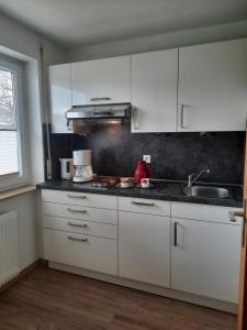 Kuchyň nebo kuchyňský kout v ubytování Gästehaus Höferlin