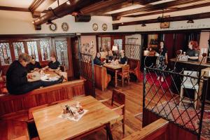 a group of people sitting at tables in a restaurant at Der Eberhard - Sleep & Dine A9 Exit 133 in Sankt Michael in Obersteiermark +63 photos
