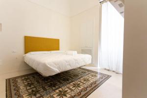 A bed or beds in a room at Viasarnelli72