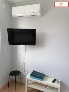 TV a/nebo společenská místnost v ubytování Immoappart
