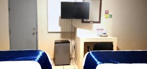 Postel nebo postele na pokoji v ubytování Pearl Point Hotel
