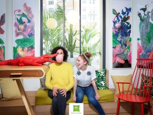 a woman and a young girl sitting in a living room at ibis Styles Bielsko Biala in Bielsko-Biała