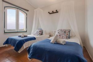 Ένα ή περισσότερα κρεβάτια σε δωμάτιο στο Casa das Furnas - Eco Home +28 φωτογραφίες
