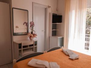 Postel nebo postele na pokoji v ubytování Hotel Admiral