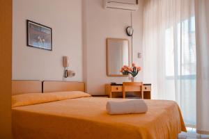 Postel nebo postele na pokoji v ubytování Hotel Admiral