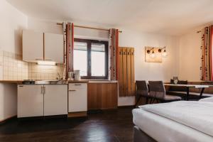 Postel nebo postele na pokoji v ubytování Alte Schmiede - das kleine Hotel