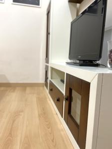 TV a/nebo společenská místnost v ubytování Apartamento Civitas