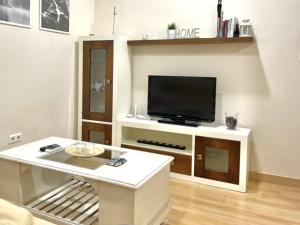TV a/nebo společenská místnost v ubytování Apartamento Civitas