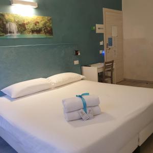 Postel nebo postele na pokoji v ubytování Bergamo City - Self Check-in