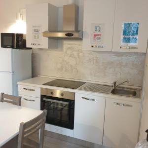 Kuchyň nebo kuchyňský kout v ubytování Bergamo City - Self Check-in