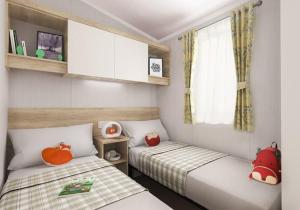 Tempat tidur dalam kamar di Biarritz Lodge