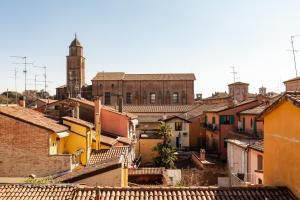 a view of a city with a clock tower and buildings at RB del Teatro&Apartaments in Imola