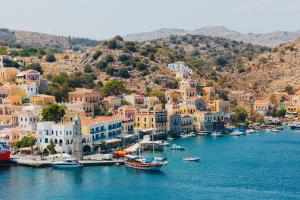 a view of a harbor with boats in the water at Marea Apartments in Symi