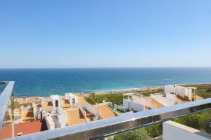 a view of the ocean from the balcony of a house at Stay In Carabassi II in Gran Alacant