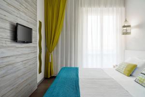 TV a/nebo společenská místnost v ubytování Hotel Madison