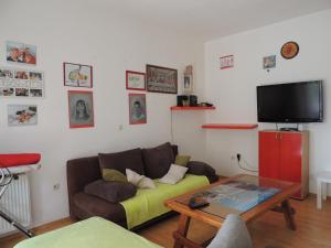 a living room with a couch and a table at Apartments Mijic in Medulin