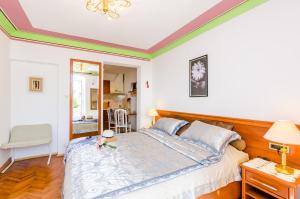 a bedroom with a bed with a teddy bear on it at Apartments Nicol in Dubrovnik