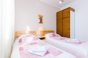 Posteľ alebo postele v izbe v ubytovaní Apartments Nicol + 36 fotografií
