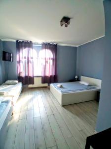 Postel nebo postele na pokoji v ubytování Central Sopot