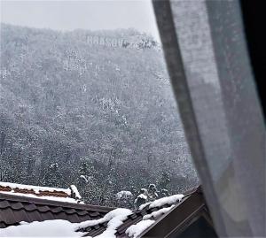 a view from the roof of a house in the snow at 92 Residence in Braşov