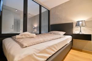 Posteľ alebo postele v izbe v ubytovaní The Place Apartments Split
