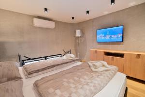 Posteľ alebo postele v izbe v ubytovaní The Place Apartments Split