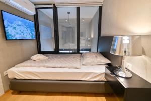 Posteľ alebo postele v izbe v ubytovaní The Place Apartments Split
