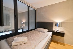 Posteľ alebo postele v izbe v ubytovaní The Place Apartments Split