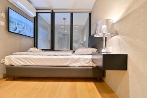 Posteľ alebo postele v izbe v ubytovaní The Place Apartments Split