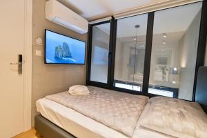 Posteľ alebo postele v izbe v ubytovaní The Place Apartments Split