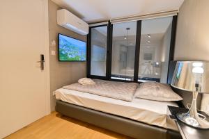 Posteľ alebo postele v izbe v ubytovaní The Place Apartments Split