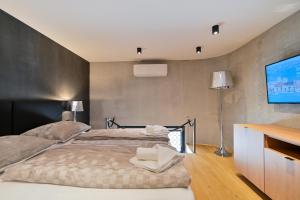 Posteľ alebo postele v izbe v ubytovaní The Place Apartments Split