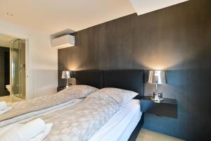 Posteľ alebo postele v izbe v ubytovaní The Place Apartments Split