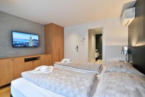 Posteľ alebo postele v izbe v ubytovaní The Place Apartments Split