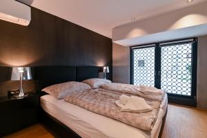 Posteľ alebo postele v izbe v ubytovaní The Place Apartments Split