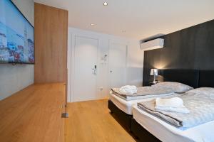 Posteľ alebo postele v izbe v ubytovaní The Place Apartments Split