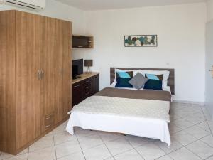Posteľ alebo postele v izbe v ubytovaní Apartments Summer Bloom